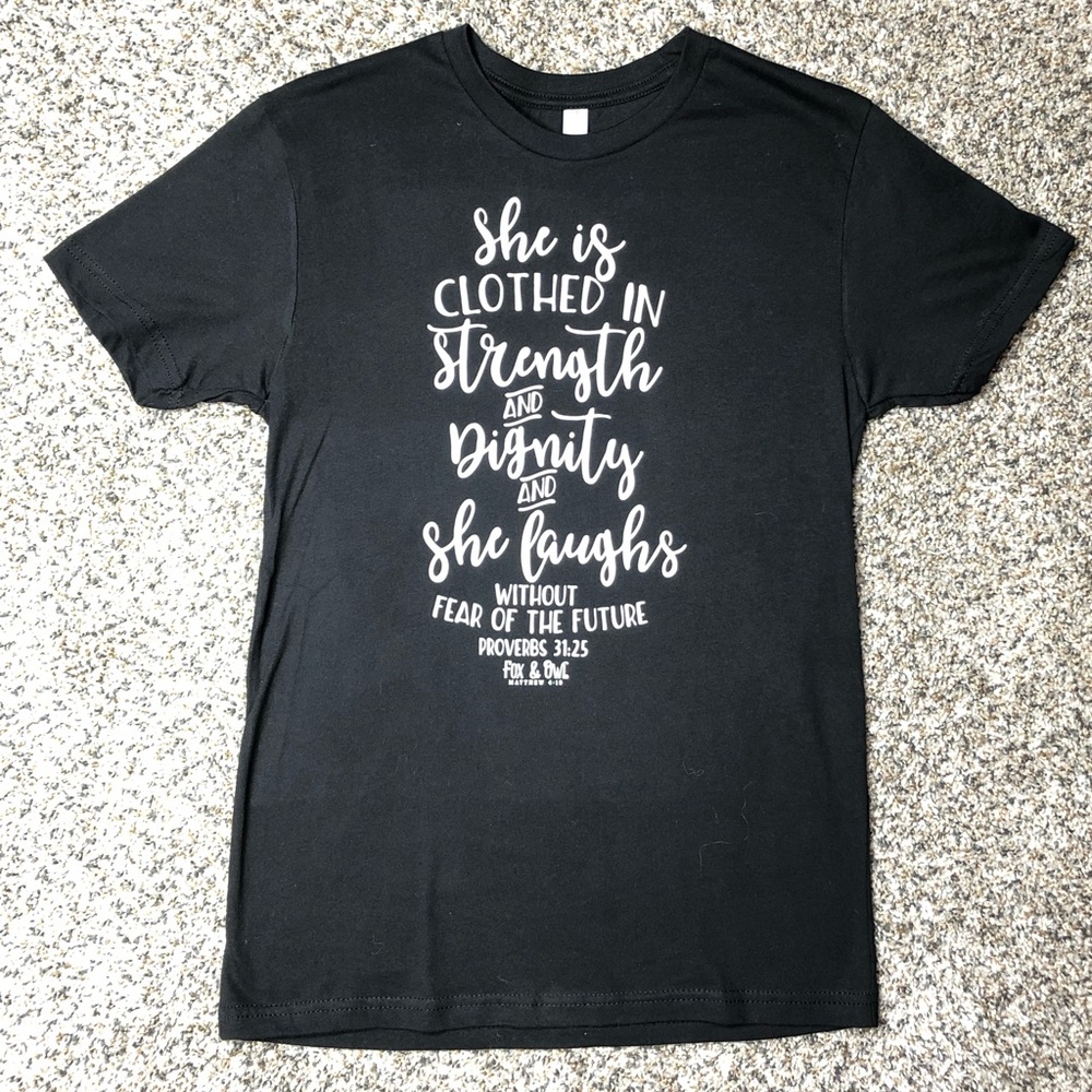 “She Is Clothed” Tee (BLACK)